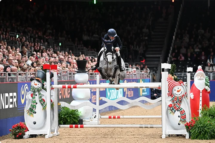 img - Equestrian jumping event indoors